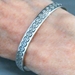 The Silver Mesa's quarter-inch wide sterling silver cuff bracelet-Scallop Rope design.  Native American made in the USA.