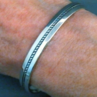 The Silver Mesas quarter-inch wide sterling silver cuff bracelet-Single Twist design.  Native American made in the USA.