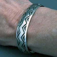 The Silver Mesas half-inch wide sterling silver cuff bracelet.  Hand stamped Lightning design.  Native American made.