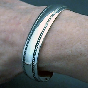 The Silver Mesa's half-inch wide sterling silver cuff bracelet.  Hand stamped Double Twist design.  Native American made.
