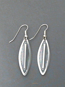 Long strip sterling silver earrings with The Silver Mesa's hand stamped Feather design. 