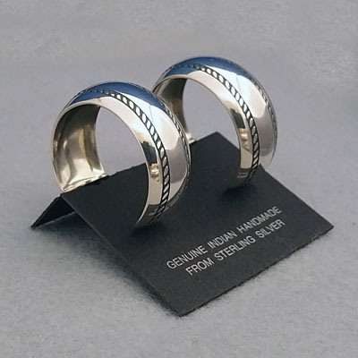 Side view-Sterling silver post hoop earrings with The Silver Mesa's Double Twist design.