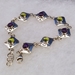 Sterling silver link bracelet with natural amethyst and peridot.  Hand made in USA.