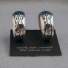 Front view-Sterling silver post hoop earrings with The Silver Mesa's Pueblo Scroll design.