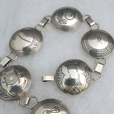 Sterling silver link belt; seventeen 1 1/2 inch pieces with Mimbres designs.