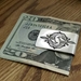 Bills slide into this 100% sterling silver money clip.