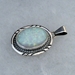 Sterling silver pendant with quality manmade Opal.  Native American made in the USA.