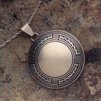 Sterling silver pendant with Mimbres Border design, 1 1/2 inch diameter.