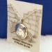 Side view-Sterling silver Mimbres pendant, 3/4 inch diameter, Wave design.