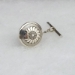 Sterling silver tie tack with Mimbres Sunflower design, 5/8 inch diameter.