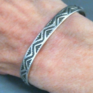 The Silver Mesa's quarter-inch wide sterling silver cuff bracelet-Lightning design.  Native American made in the USA.