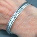 The Silver Mesa's quarter-inch wide sterling silver cuff bracelet-Bird design.  Native American made in the USA.
