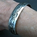 The Silver Mesa's half-inch wide sterling silver cuff bracelet.  Hand stamped Pueblo Scroll design.  Native American made.