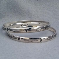 Sterling silver bangle with hand stamped Feather design.  Native American made.