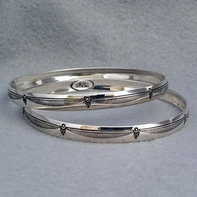 Sterling silver bangle with hand stamped Feather design.  Native American made.