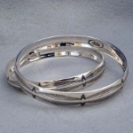Sterling silver bangle with hand stamped Feather design.  Native American made.