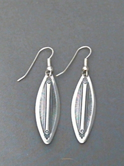 Long strip sterling silver earrings with The Silver Mesa's hand stamped Feather design. 