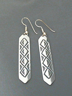 Large long strip sterling silver earrings with The Silver Mesa's hand stamped Diamond Back design. 
