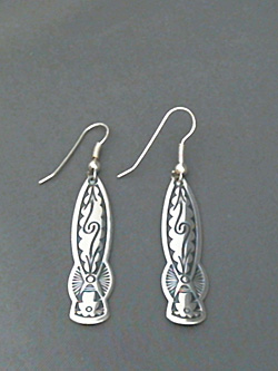 Long strip sterling silver earrings with The Silver Mesa's hand stamped Pueblo Scroll design. 