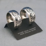 Side view-Sterling silver post hoop earrings with The Silver Mesa's Pueblo Scroll design.