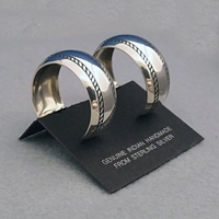 Side view-Sterling silver post hoop earrings with The Silver Mesas Double Twist design.
